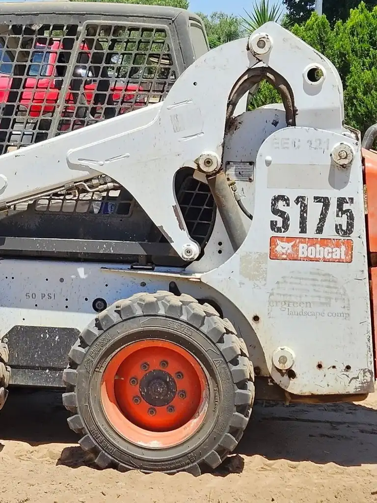 Superior Hauling Bobcat S175 and work truck on a Central Valley job site