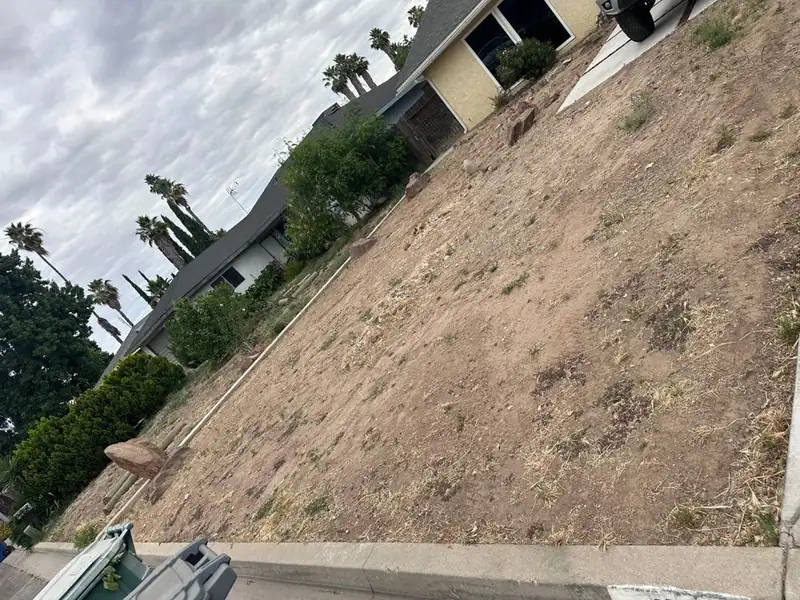 Sloped front lot graded smooth in a Central Valley neighborhood