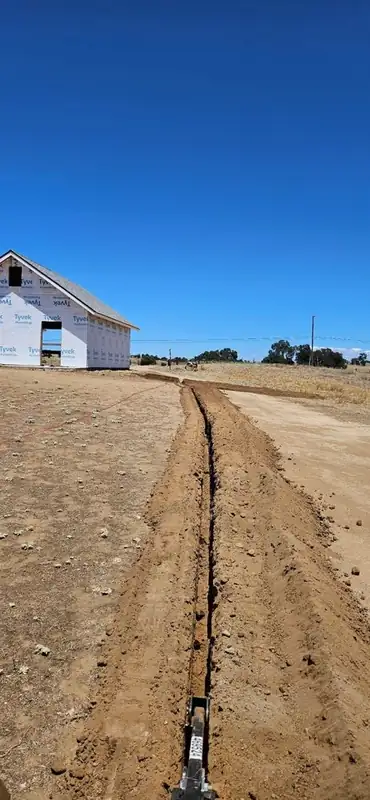 Trench line dug toward a new construction build in the Central Valley
