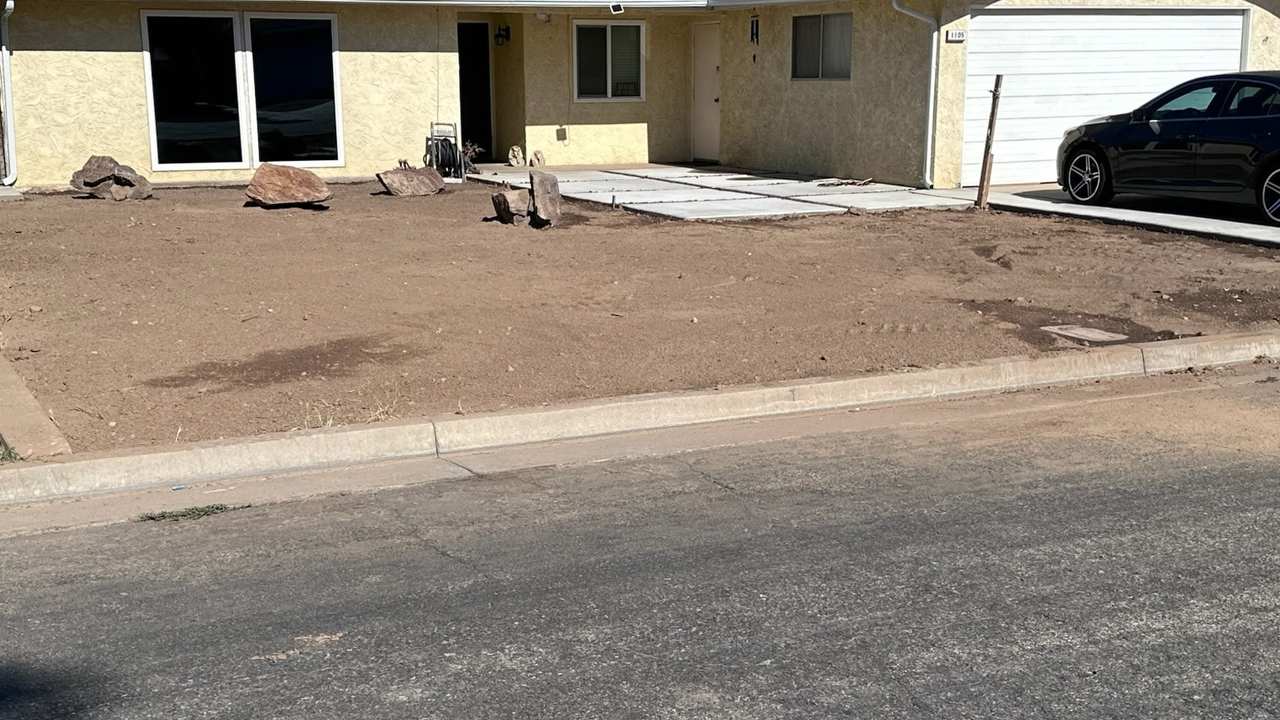 Freshly graded Central Valley front driveway ready for gravel delivery by Superior Hauling
